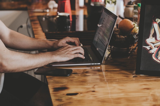 Man typing on Computer